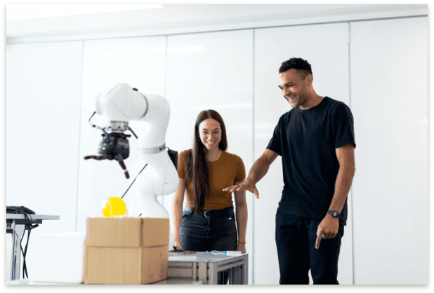 Engineers testing robotic arm