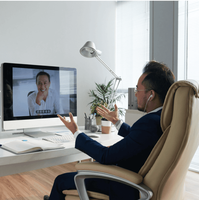Worker having zoom meeting with client