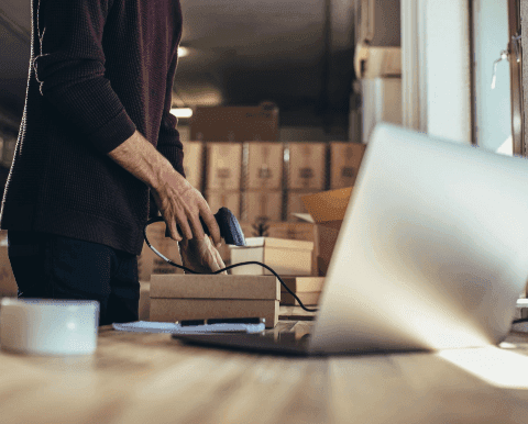 Worker scanning box barcode